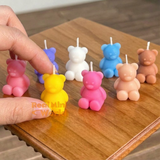 Real functioning miniature teddy bear candles in pink, yellow, blue, and pastel colors with wicks, cute bear-shaped candles for miniature displays and dollhouse decorations by Real Mini World.
