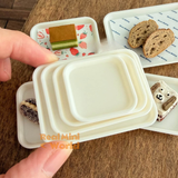 Miniature white serving trays in multiple sizes for mini cooking, tiny food presentation, dollhouse kitchen accessories, and miniature bakery displays by Real Mini World.