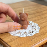 Real functioning miniature teddy bear candles in dark brown with real wicks, cute bear-shaped candles for miniature displays and dollhouse decorations by Real Mini World.