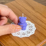 Real functioning miniature teddy bear candles in purple with wicks, cute bear-shaped candles for miniature displays and dollhouse decorations handmade by Real Mini World.