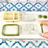 Caja bento en miniatura con cara sonriente