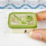 Caja bento en miniatura con cara sonriente