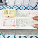 Caja bento en miniatura con cara sonriente