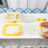 Caja bento en miniatura con cara sonriente