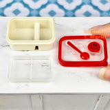 Caja bento en miniatura con cara sonriente