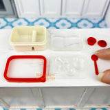 Caja bento en miniatura con cara sonriente