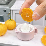 Exprimidor manual de cítricos REAL en miniatura (rosa)