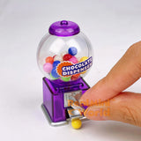 Real functioning miniature chocolate dispenser in purple from RealMiniWorld — palm-sized gumball machine that actually works